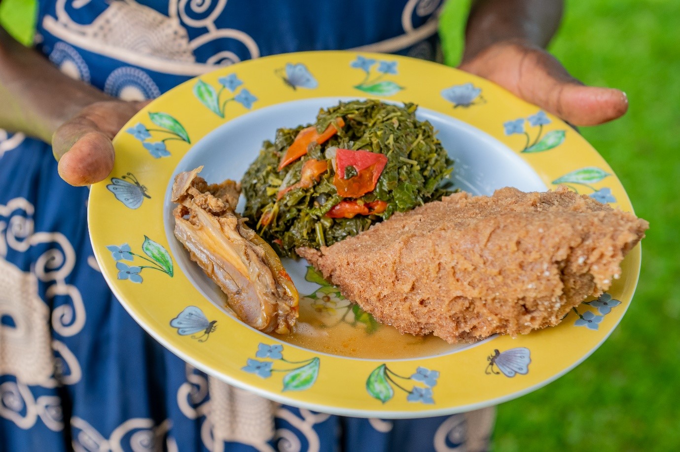 Cassava brown ugali with chicken and kienyeji vegetables