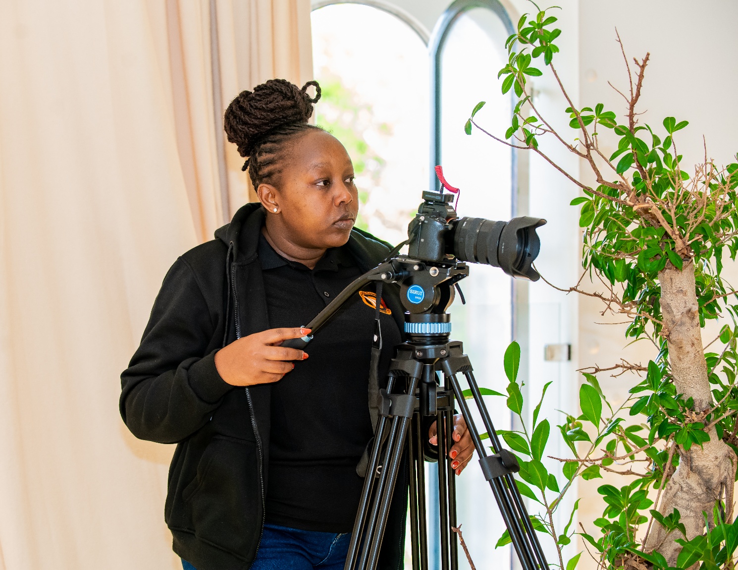 Anne Kibei behind the camera at TU Delft